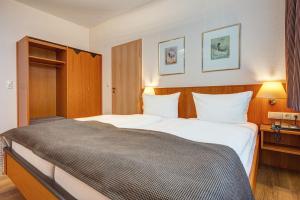 Postel nebo postele na pokoji v ubytování Komforthotel Kaiserhof