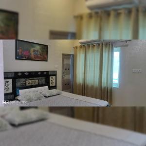 Schlafzimmer mit einem Bett und einem Fenster mit Vorhängen in der Unterkunft Couple Friendly Hotel - Sunset in Orchha