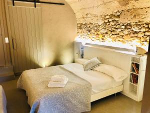 Postel nebo postele na pokoji v ubytování Can Clotas Hotel Masia