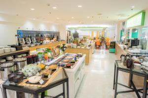 a kitchen with a lot of food on the counter at ANA Holiday Inn Sapporo Susukino by IHG in Sapporo