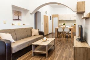 a living room with a couch and a table at Kolymbia memories house in Kolymbia