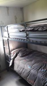 an empty bunk bed in a room with a bed sqor at Le Chal Adret in Cardonville