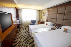 Postelja oz. postelje v sobi nastanitve Metropark Hotel Kowloon