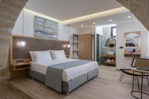 Postel nebo postele na pokoji v ubytování Casa D'Irene Deluxe Hotel