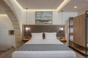 Postel nebo postele na pokoji v ubytování Casa D'Irene Deluxe Hotel