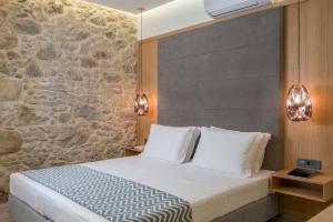 Postel nebo postele na pokoji v ubytování Casa D'Irene Deluxe Hotel