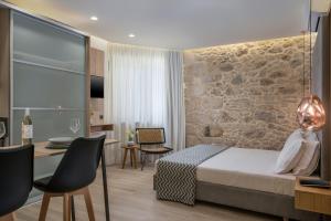 Postel nebo postele na pokoji v ubytování Casa D'Irene Deluxe Hotel