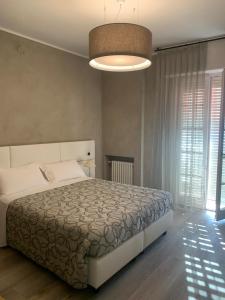 Łóżko lub łóżka w pokoju w obiekcie Hotel Conca D'Oro ***S