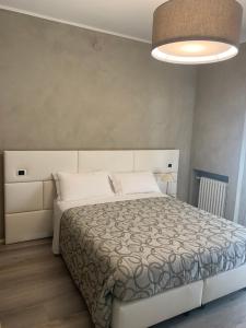 Łóżko lub łóżka w pokoju w obiekcie Hotel Conca D'Oro ***S