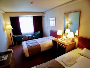 Postel nebo postele na pokoji v ubytování Tokyo Grand Hotel + 17 fotografií