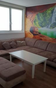 a living room with a couch and a coffee table at Monteurzimmer/Ferienwohnung Roßheidestraße, Gladbeck in Gladbeck