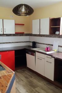 a kitchen with white cabinets and a counter top at Monteurzimmer/Ferienwohnung Roßheidestraße, Gladbeck in Gladbeck