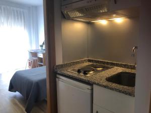 a kitchen with a sink and a counter top at MiCampus Burjassot in Burjassot