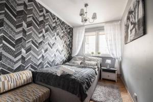Posteľ alebo postele v izbe v ubytovaní Silver Pańska 61
