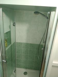 a shower with a glass door in a bathroom at Isi GuestHouse in Iesi +68 photos