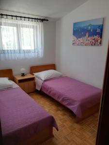 Posteľ alebo postele v izbe v ubytovaní Apartman Čupić