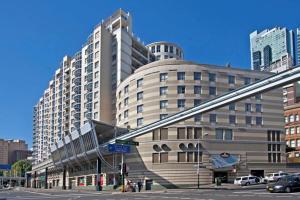 a large building on a street in a city at Accommodation Sydney 38 Harbour Street Sydney in Sydney