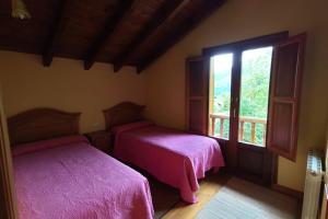 Tempat tidur dalam kamar di Casa el Viñadal