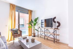 TV a/nebo společenská místnost v ubytování Heima Gran Vía A