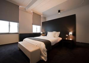 Uma cama ou camas num quarto em Hotel Messeyne