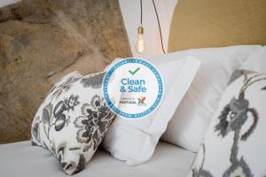 Cama ou camas em um quarto em Lugares Com História