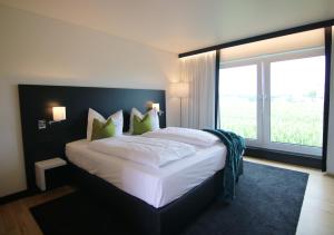 Postel nebo postele na pokoji v ubytování WÜ Hotel by WMM Hotels