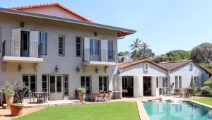 a house with a swimming pool and a yard at Maison H Guest House in Durban