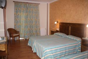 Кровать или кровати в номере PARAISO PLAYA Hotel