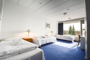 Postel nebo postele na pokoji v ubytování Hotel Østersø + 37 fotografií