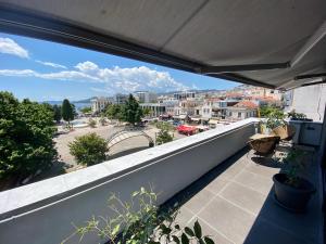 a balcony with a view of a city at Urban Loft & Urban Flat 2024 in Kavala