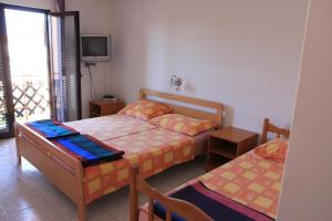 Postel nebo postele na pokoji v ubytování Apartment Dragica
