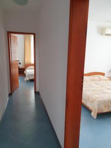 A bed or beds in a room at Family Hotel Maritime