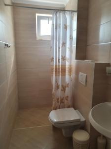 A bathroom at Family Hotel Maritime Még 37 kép