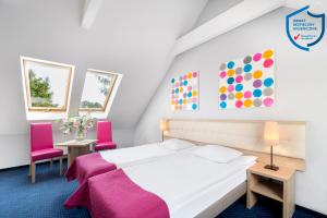 Posteľ alebo postele v izbe v ubytovaní Hotel Petrus