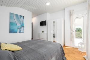 Postel nebo postele na pokoji v ubytování Villa Polion Peroj