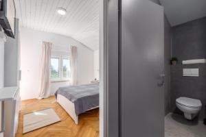 Postel nebo postele na pokoji v ubytování Villa Polion Peroj