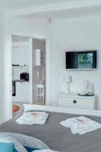 Televízia a/alebo spoločenská miestnosť v ubytovaní Apartament Heaven Bay