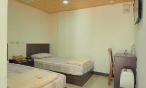 Postel nebo postele na pokoji v ubytování Dongyin Homestay連江縣民宿054號