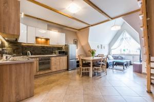 Kuchyňa alebo kuchynka v ubytovaní Apartamenty Stroma Odkryj Zakopane