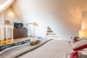Posteľ alebo postele v izbe v ubytovaní Apartamenty Stroma Odkryj Zakopane