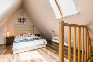 Posteľ alebo postele v izbe v ubytovaní Apartamenty Stroma Odkryj Zakopane
