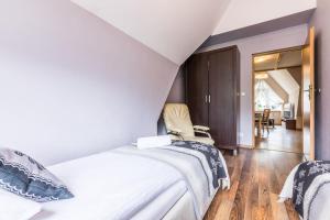 Posteľ alebo postele v izbe v ubytovaní Apartamenty Stroma Odkryj Zakopane