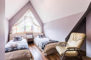 Posteľ alebo postele v izbe v ubytovaní Apartamenty Stroma Odkryj Zakopane