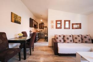a living room with a couch and a table at Apartment Rita in Zadar