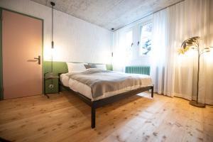 Ein Bett oder Betten in einem Zimmer der Unterkunft TREMONDI - Boutique BnB