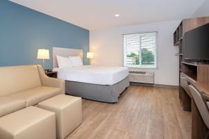 Ένα ή περισσότερα κρεβάτια σε δωμάτιο στο WoodSpring Suites Carol Stream - Chicago +7 φωτογραφίες