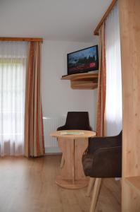 TV a/nebo společenská místnost v ubytování Haus Wally