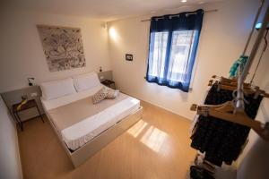 Postel nebo postele na pokoji v ubytování San Vito Accommodations