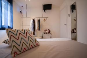 Postel nebo postele na pokoji v ubytování San Vito Accommodations