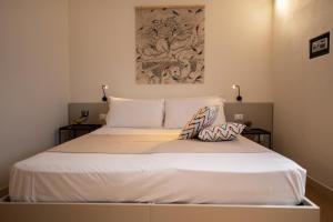 Postel nebo postele na pokoji v ubytování San Vito Accommodations